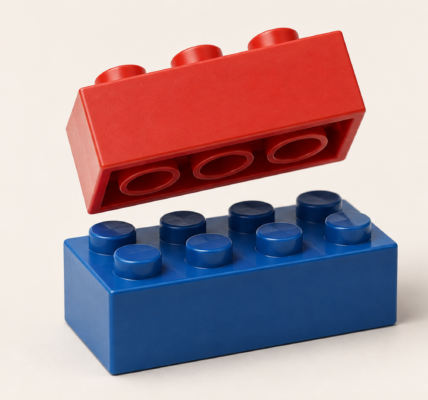 A red construction brick shown from underneath with visible tubes above a blue studded brick, illustrating the stud-and-tube principle.