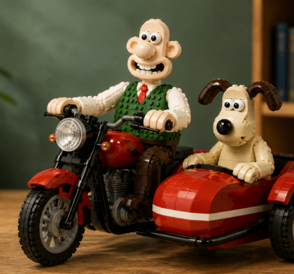 Brick-built illustration of Wallace and Gromit riding a motorcycle with a red sidecar in a restrained studio setting.