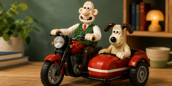 Brick-built illustration of Wallace and Gromit riding a motorcycle with a red sidecar in a restrained studio setting.