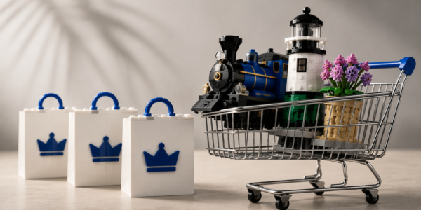 A shopping cart with three brick-built models beside three white bags, representing the option to add up to three physical LEGO Insiders rewards to one order.