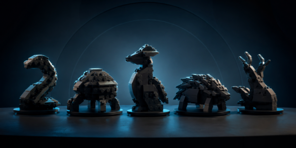 Five generic dark brick-built creature models displayed on stands and lit with blue light.