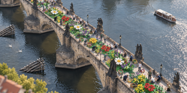 An aerial view of Charles Bridge in Prague covered with a shared meadow of brick-built flowers while people add more plants above the river.